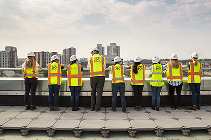 MWDBE (minority, women, and disadvantaged business enterprises) team looking over balcony