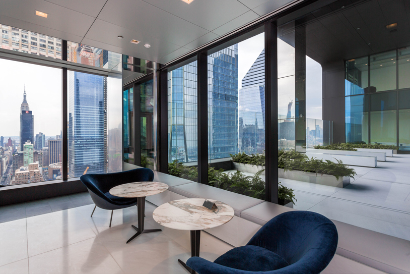 Milbank New York's modern office with large windows offering a panoramic view of the New York skyline.