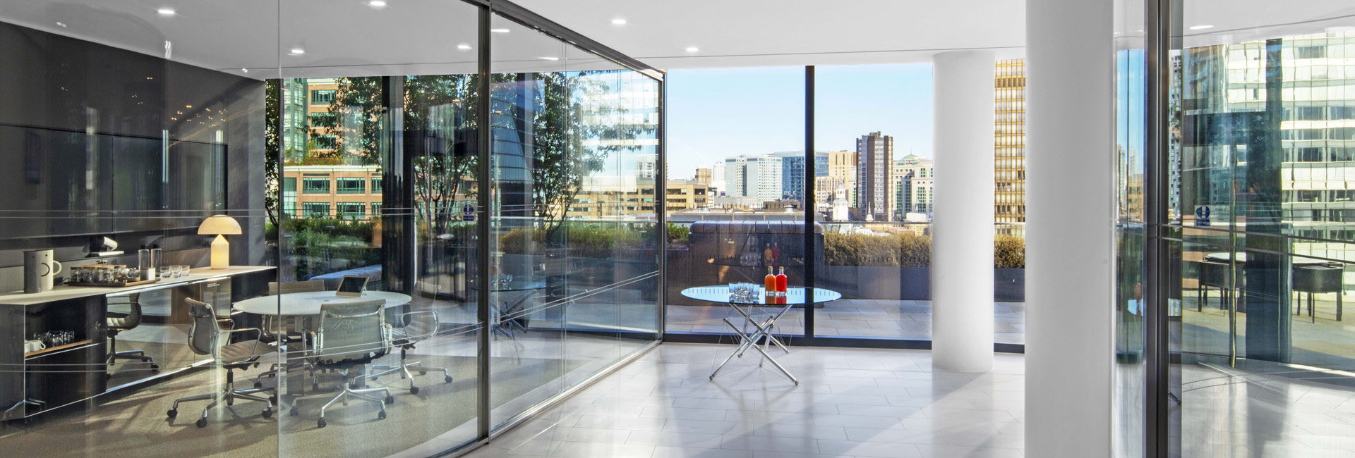 Milbank London's office space with a modern meeting room with transparent walls.