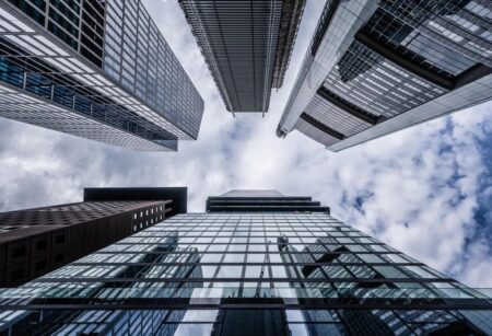 A street view looking up at a collection of skyscrapers