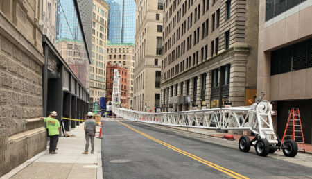 Safety crane pick in downtown Boston