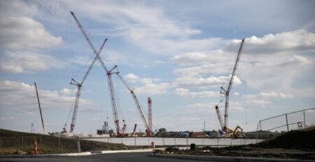 An active construction site with cranes