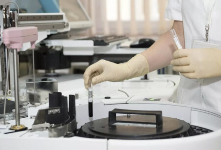 A lab worker holding a test tube