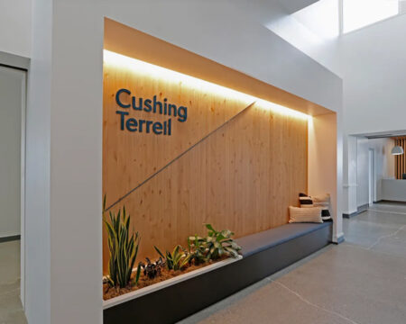 Modern office design by Cushing Terrell featuring sleek lines, open spaces, and natural light.