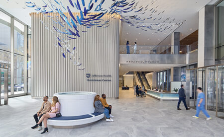 Lobby area of the Jefferson Health Honickman Center featuring an art installation above.