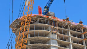 A building under construction with a crane