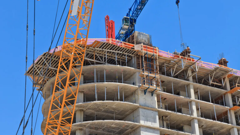 A building under construction with a crane