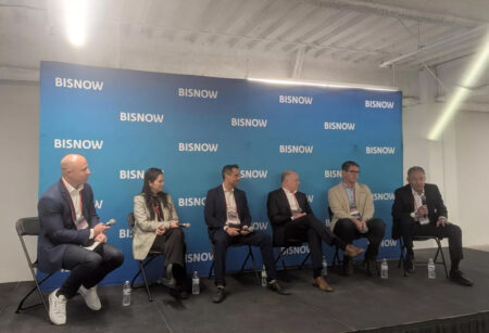 A panel of executives discussing