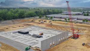 Construction site with crain concrete structure and dirt