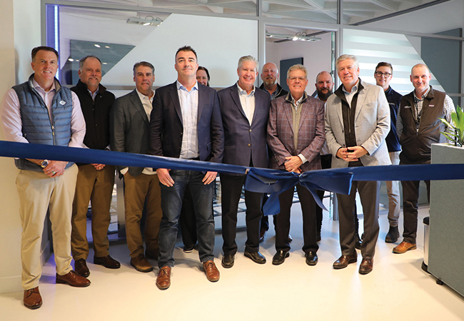 Picture of men cutting the ribbon of the new Structure Tone Amsterdam Mission Critical Office