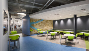 Picture of a lounge or eating area with lime green chairs and a map of downtown Manhattan