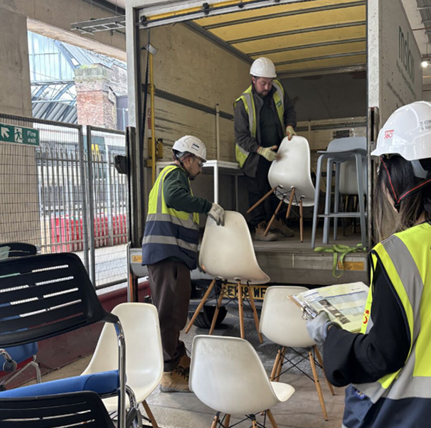 UK Sustainability pic people wearing safety gear loading a van