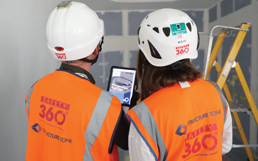 Construction worker holding an iPad
