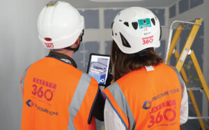 Construction worker holding an iPad