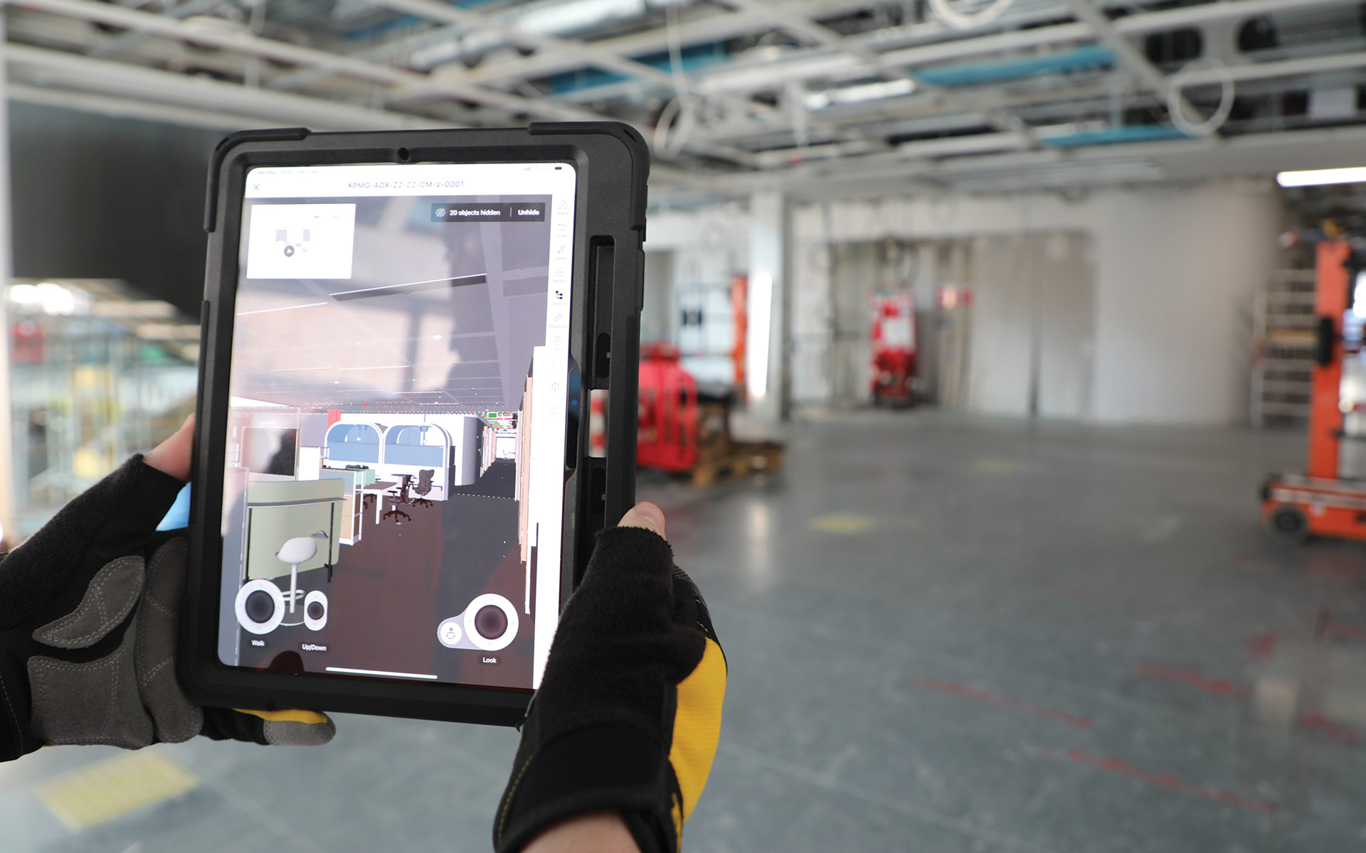 Construction worker holding an iPad