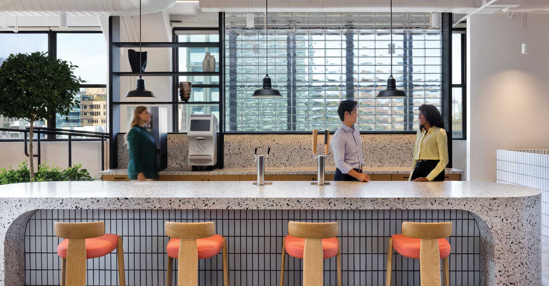 A kitchen area with a ktichen island for employees to use