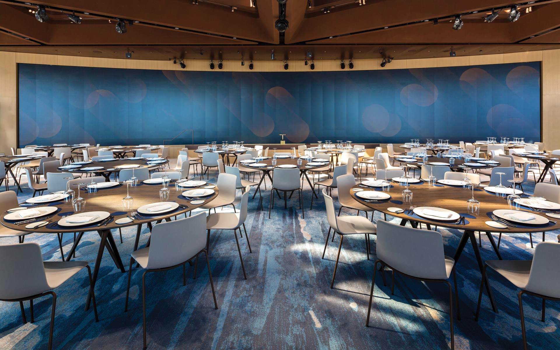 Large dining area with multiple tables and chairs.