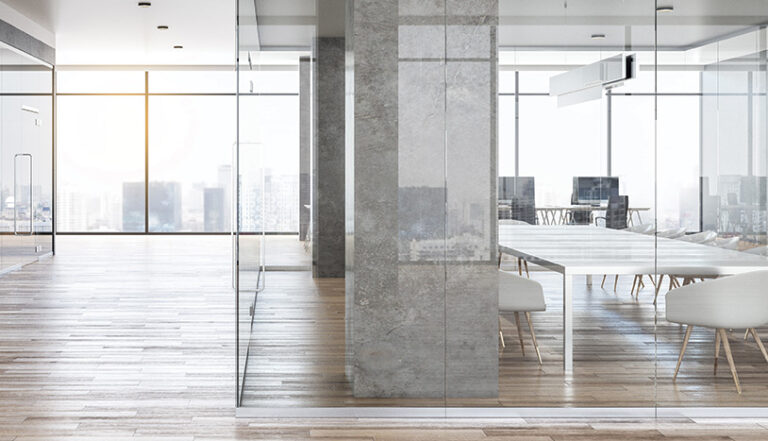 Sleek white interior with wall of windows